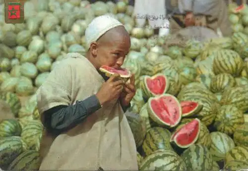 Postcard Morocco Agadir Grand Socco ethnic young boy eating watermelon