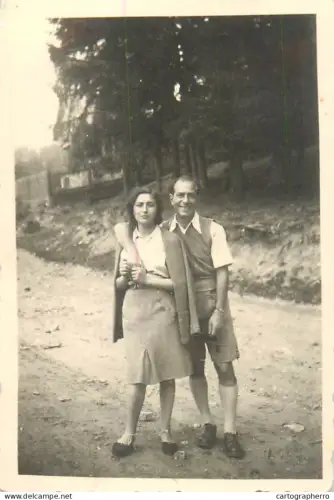 Anonymous persons couple souvenir photo