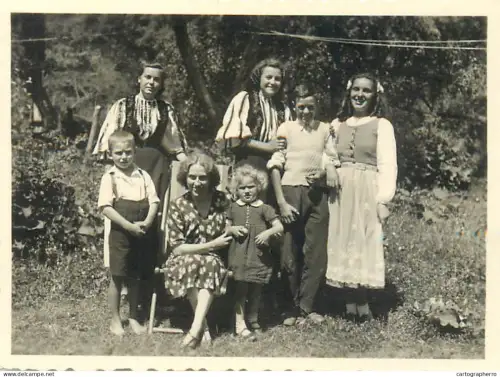 Anonymous persons family group souvenir photo folk costumes