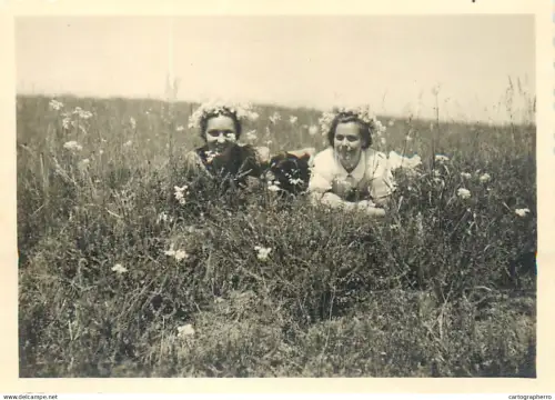 Anonymous persons girls flowers field souvenir photo