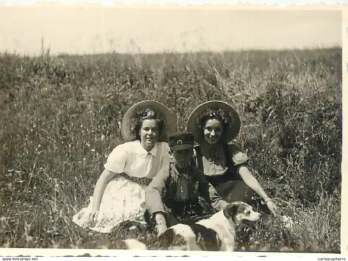 Anonymous persons with dog souvenir photo