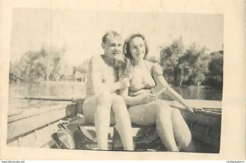 Anonymous persons couple in a boat souvenir photo