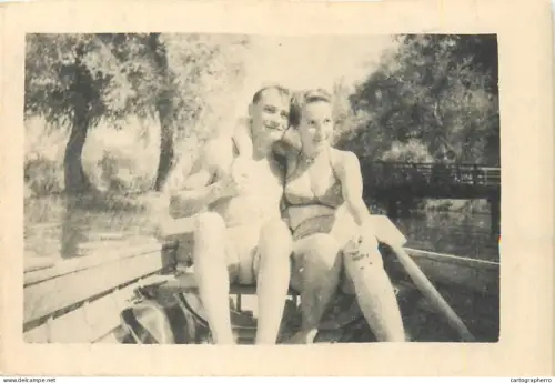 Anonymous persons couple in a boat souvenir photo