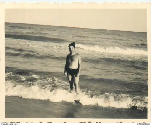 Anonymous persons man seaside souvenir photo
