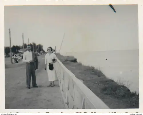 Anonymous persons seascape souvenir photo