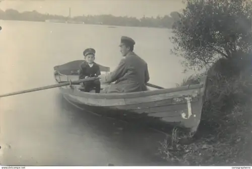 A5810 Anonymous persons souvenir vintage photographic postcard man and child rowing boat place to identify