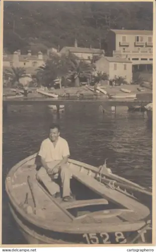 A5920 person in a small wooden boat photo place to identify