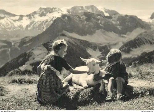 A5392 Switzerland children boy and girl with goat mountain scenery