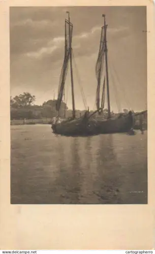A5857 Two wooden fishing sailboats docked near the waterfront old postcard
