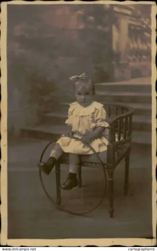 A5926 Children > Portraits little girl posing on chair studio souvenir vintage photographic postcard