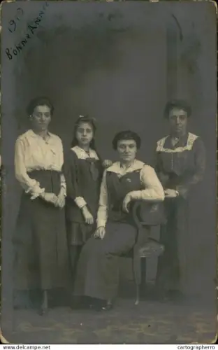 A5926 Children and family groups souvenir photographic postcard 1919