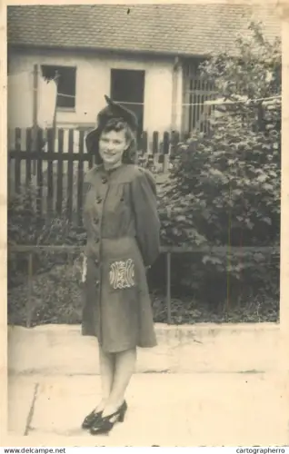 A5941 Anonymous young woman wearing a 1940s-style coat and hat photographic postcard