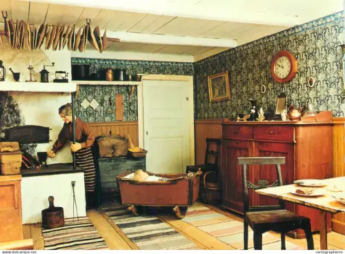 A5541 Historic Swedish house interior aspect woman cooking