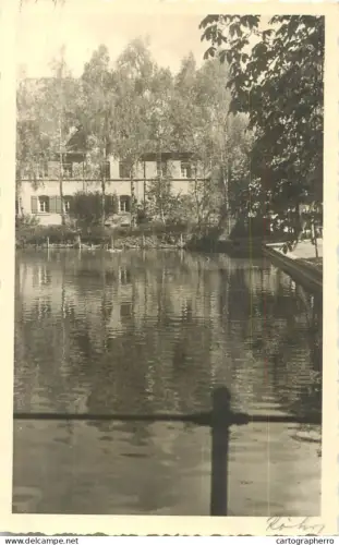A5974 Photographic postcard lake surrounded by trees and a building in the background place to identify