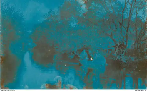 A6052 degraded image depict a tranquil scene on the shore of a water or river strong blue hue and an old texture