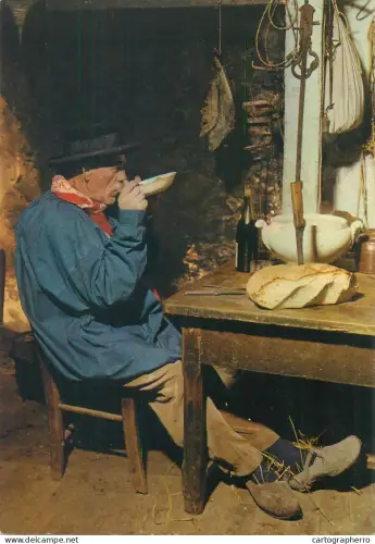 France En Perigord faire chabrot man finishing a bowl of soup
