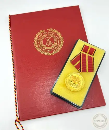 DDR Verdienstmedaille der NVA in Gold Urkunde Oberstleutnant 1977 Bartel 145e