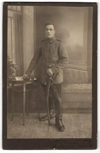Fotografie F. X. Schröck, Laufen, Portrait Soldat in Feldgrau mit Säbel