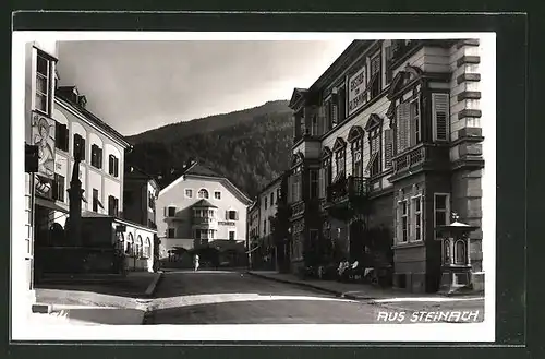 AK Steinach, Wettersäule in Strassenpartie mit Hotel Steinbock