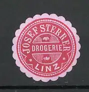 Präge-Reklamemarke Drogerie Josef Sterrer zu Linz, rot