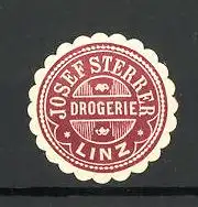 Präge-Reklamemarke Drogerie Josef Sterrer zu Linz, rot