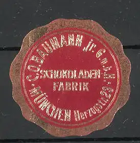 Präge-Reklamemarke Schokoladenfabrik Baumann GmbH in München