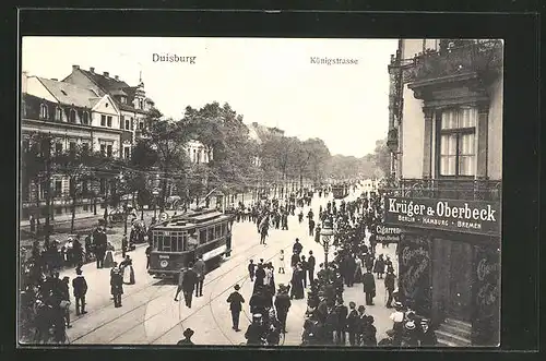 AK Duisburg, reges Treiben in der Königstrasse mit Strassenbahnen & Krüger & Oberbeck Geschäft