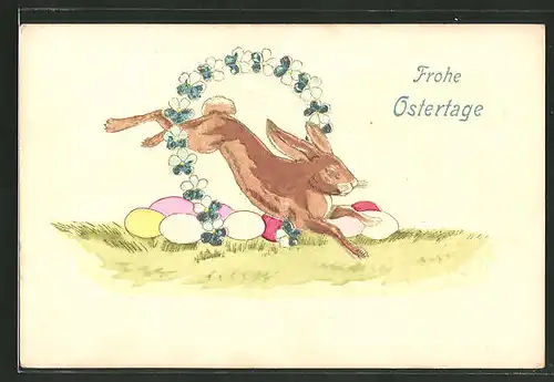 Präge-AK Osterhase springt durch einen Blumenkranz