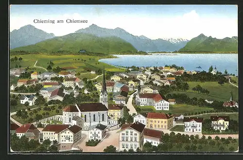 AK Chieming / Chiemsee, Ortspanorama mit Kirche und Gebirge im Hintergrund