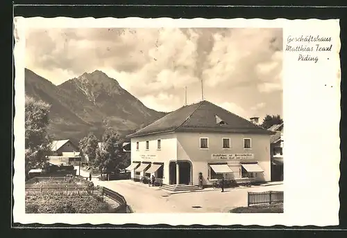 AK Piding, Geschäftshaus Matthias Traxl mit Bergen im Hintergrund
