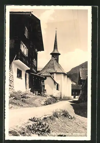 AK Compadials bei Disentis, Partie am Hotel Pension Badus mit Blick zur Kirche