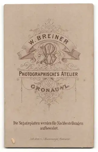 Fotografie W. Breiner, Gronau a. L., Bürgerliche mit Dutt im gestreiften Kleid