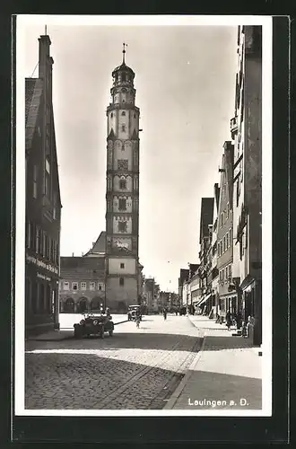 AK Lauingen a. D., Strassenpartie mit Glockenturm