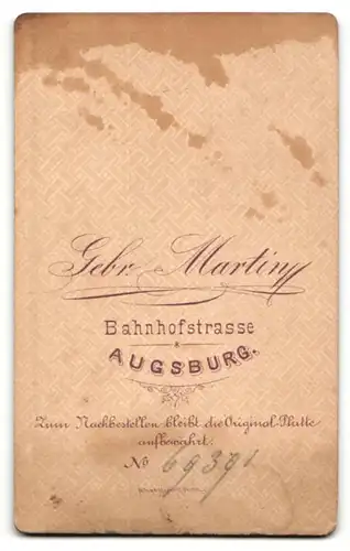 Fotografie Gebr. Martin, Augsburg, Portrait Herr mit zurückgekämmtem Haar