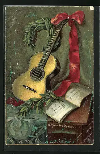 AK Gitarre mit rotem Band neben dem Notenbuch