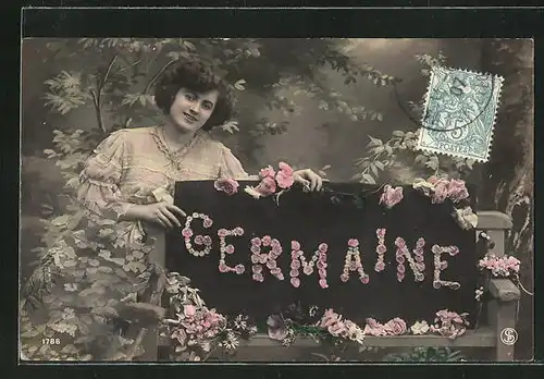 AK Namenstag, Germaine, Schriftzug aus Blumen, Frau hinter Bank