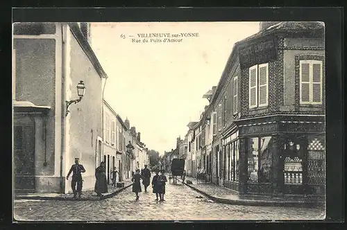 AK Villeneuve-sur-Yonne, Rue du Puits d`Amour, Passanten an einer Hausecke