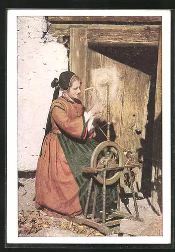 AK Bäuerin in Tracht aus Maltatal an einem Spinnrad