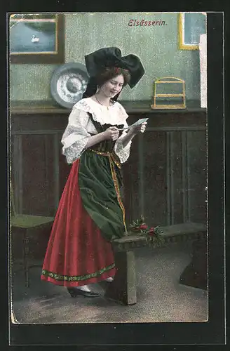 AK Elsässerin in elsass-lothringischer Tracht liest eine Brief