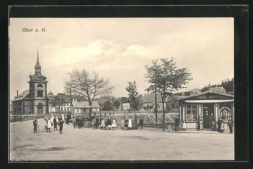 AK Oker a. H., Strassenpartie mit AK-Verkauf und Kirche