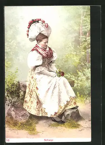 AK Schweizerin auf der Bank in Tracht