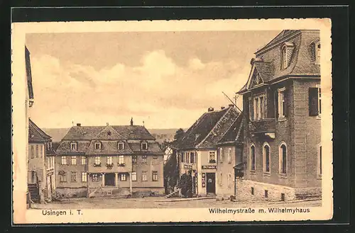 AK Usingen i. T., Wilhelmystrasse mit Geschäften und Wilhelmyhaus