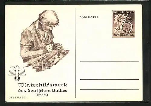 AK Ganzsache WHW Winterhilfswerk des Deutschen Volkes 1938 /39, Monat Dezember, Arbeiterin bemalt Figuren
