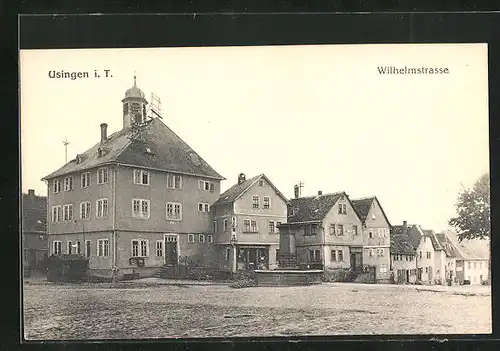 AK Usingen i. T., Wilhelmstrasse mit Kirche
