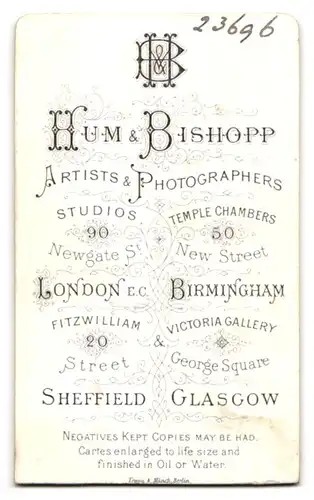 Fotografie Hum & Bishopp, London-EC, 20, Fitzwilliam Street, Portrait stattlicher Herr mit Backenbart und Fliege