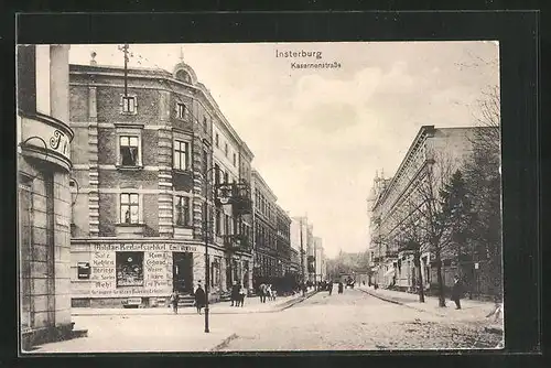 AK Insterburg, Kasernenstrasse mit Geschäft