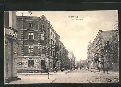 AK Insterburg, Kasernenstrasse mit Geschäft