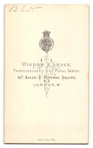 Fotografie Window & Grove, London, 63a Baker St., Portrait stattlicher Herr mit Kotelettenbart im Mantel