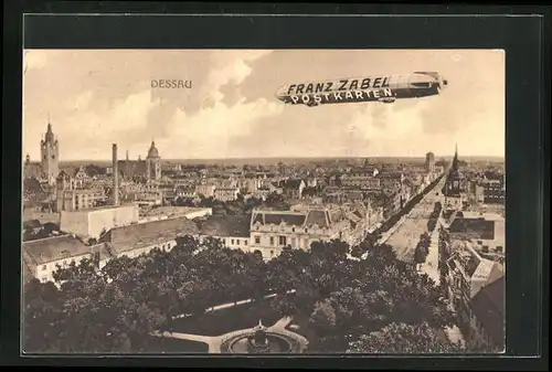 AK Dessau, Teilansicht und Zeppelin mit AK-Reklame Franz Zabel
