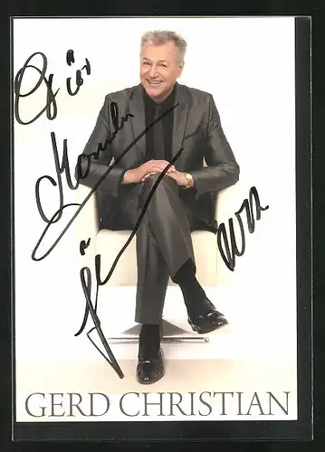 Künstler-AK sign.: Gerd Christian, in einem Ledersessel sitzend mit Gruss, Autogrammkarte